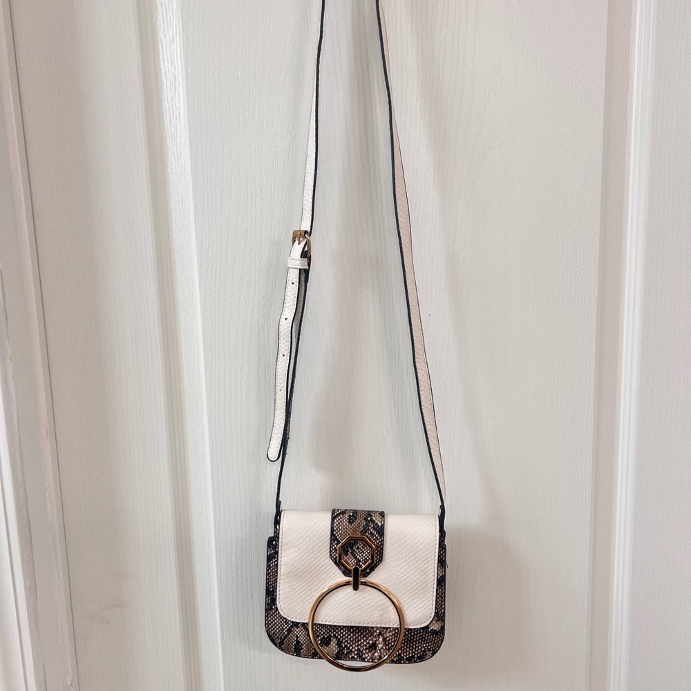 White and snakeskin purse